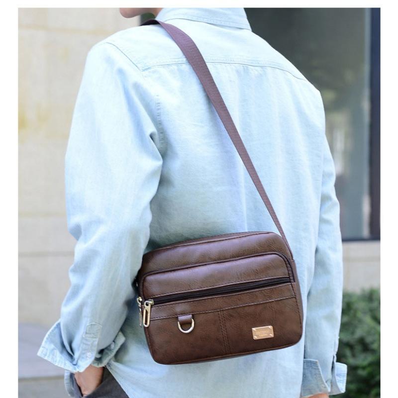 レザーメンズスリングバッグメッセンジャーショルダークロスボデ - Leather Work Bag Laptop のレビューと価格